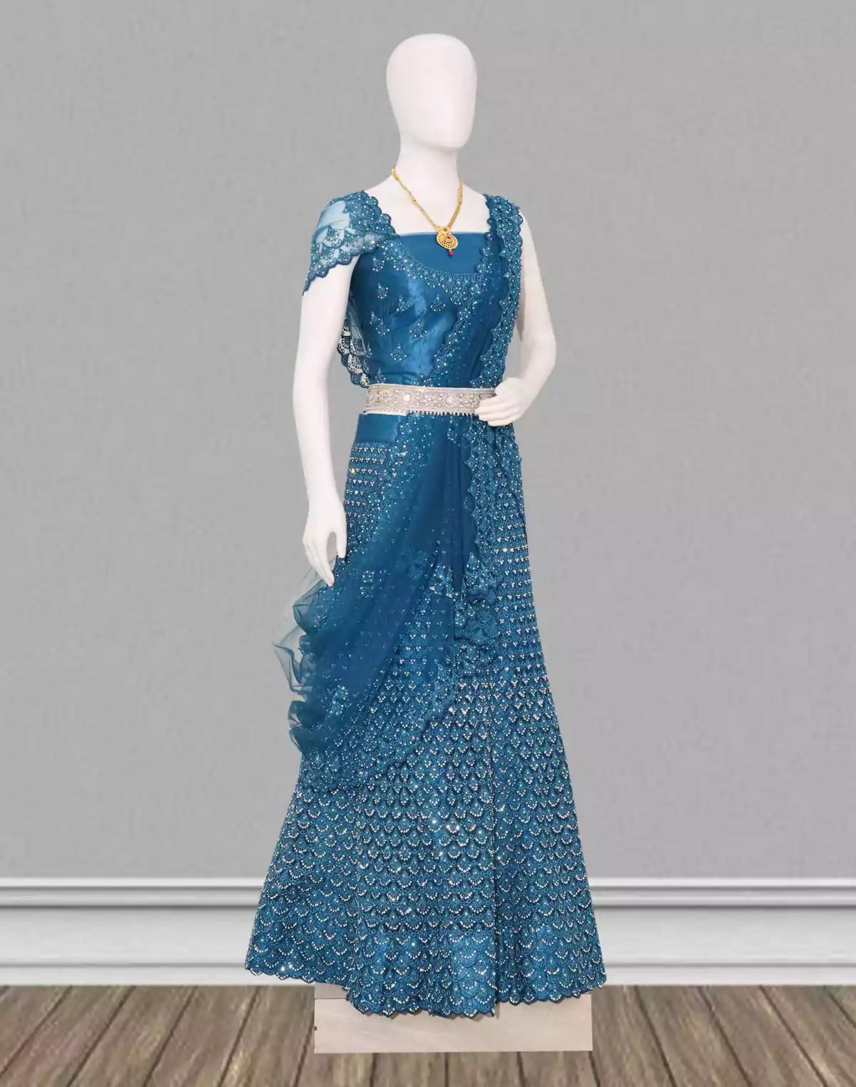 Image of Traditional party wear Peacock Blue floral stones work Netted fabric lehenga set