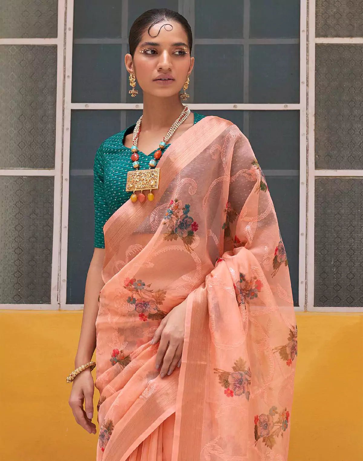 Image of Peach Organza Floral Print Saree With Tussels and Contrasting Blue Blouse - South India Shopping Mall