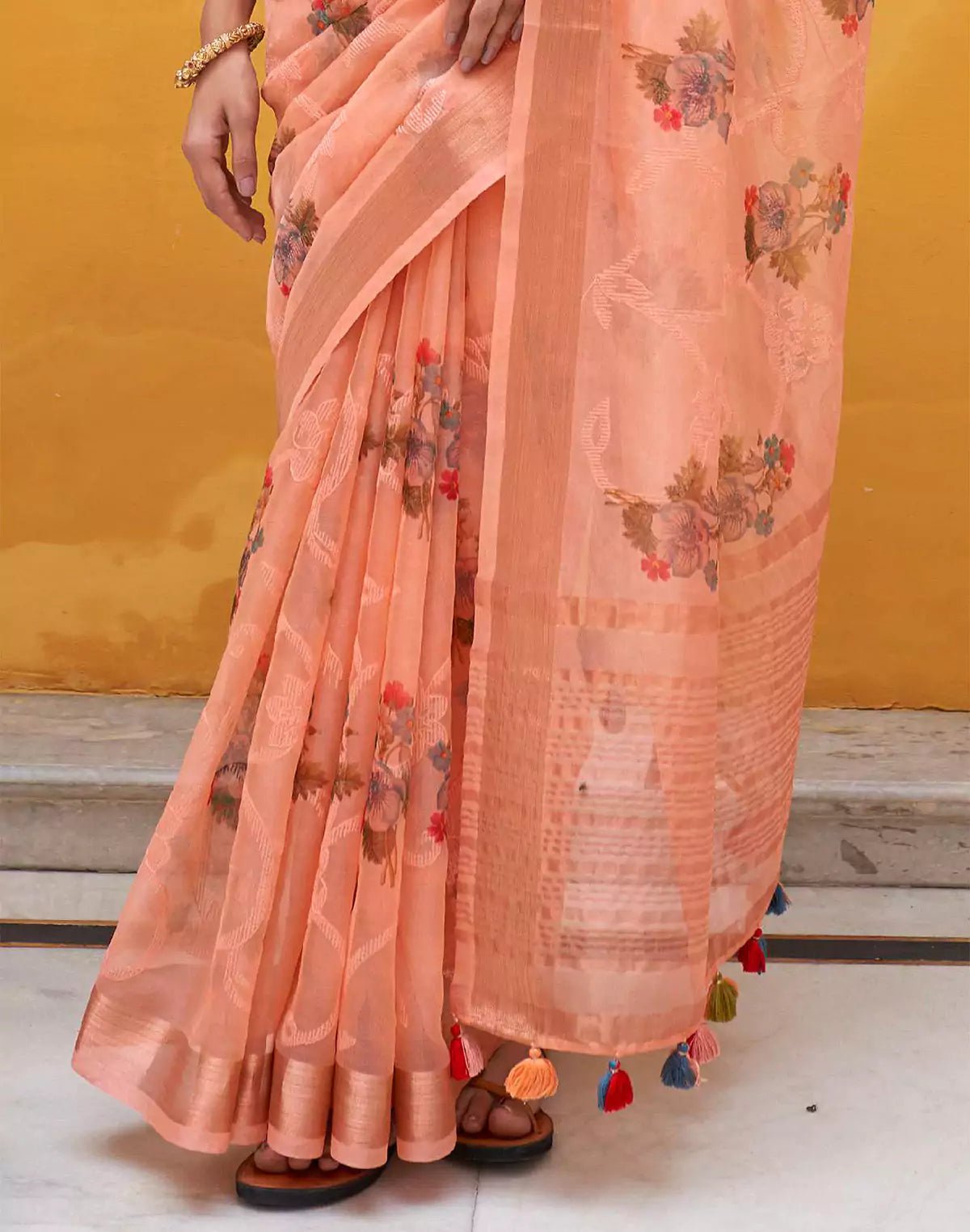 Image of Peach Organza Floral Print Saree With Tussels and Contrasting Blue Blouse - South India Shopping Mall