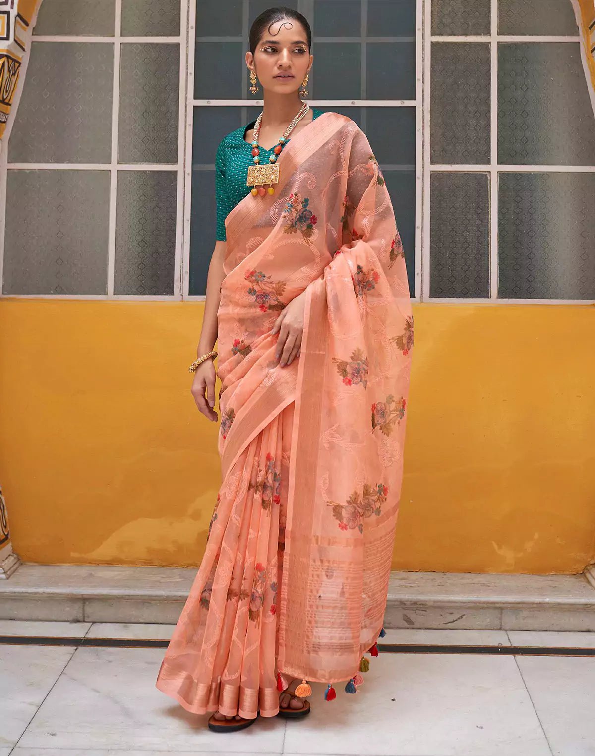 Image of Peach Organza Floral Print Saree With Tussels and Contrasting Blue Blouse - South India Shopping Mall