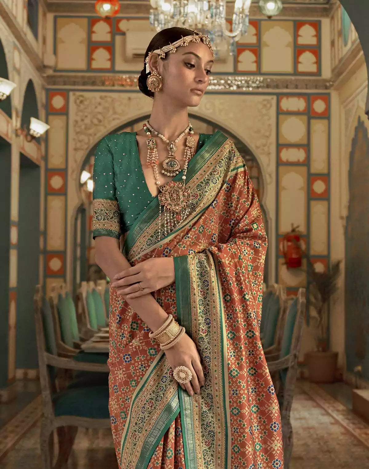 Image of Beautiful Orange Ikat Print Patola Saree