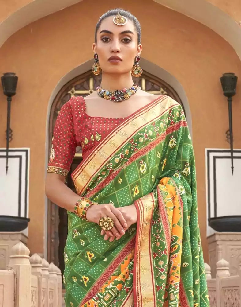 Image of Green Ikat Pattern Mirror work Patola Saree