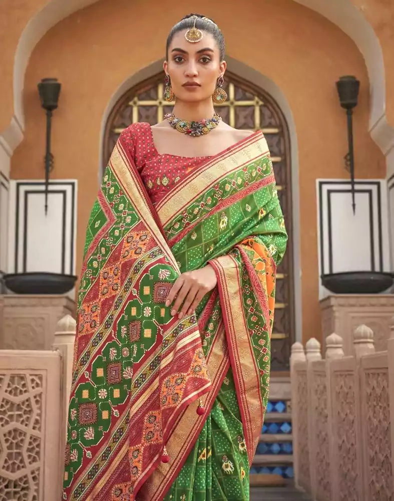 Image of Green Ikat Pattern Mirror work Patola Saree