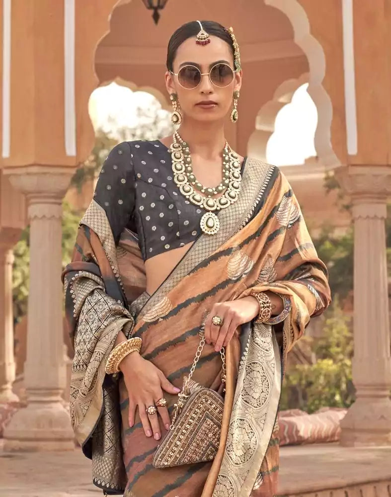 Image of Brown Ethnic Motifs Printed Patola Silk Saree