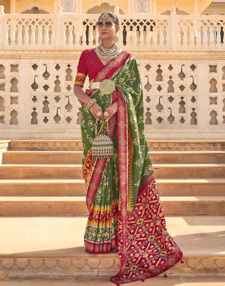 Image of Stylish Mehendi Green Ikat Print Patola Saree