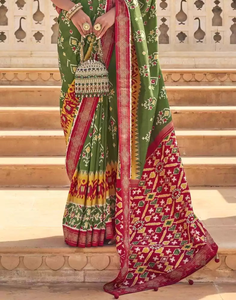 Image of Stylish Mehendi Green Ikat Print Patola Saree