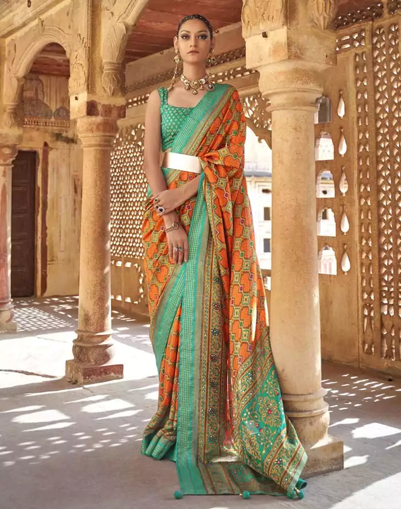 Image of Fascinating Orange Geometric Print Patola Saree