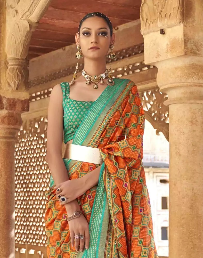 Image of Fascinating Orange Geometric Print Patola Saree