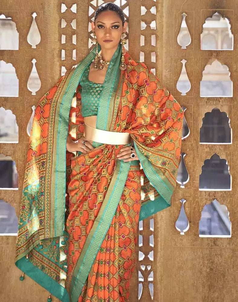 Image of Fascinating Orange Geometric Print Patola Saree