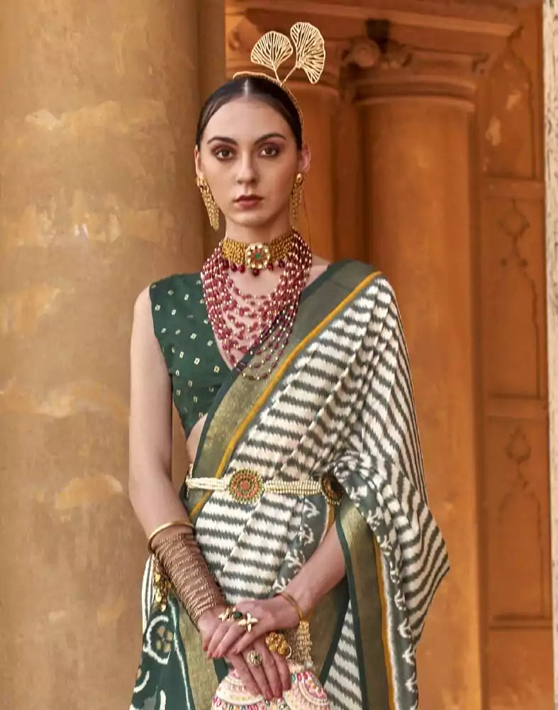 Image of Off White Stripes Pattern Patola Fabric Saree