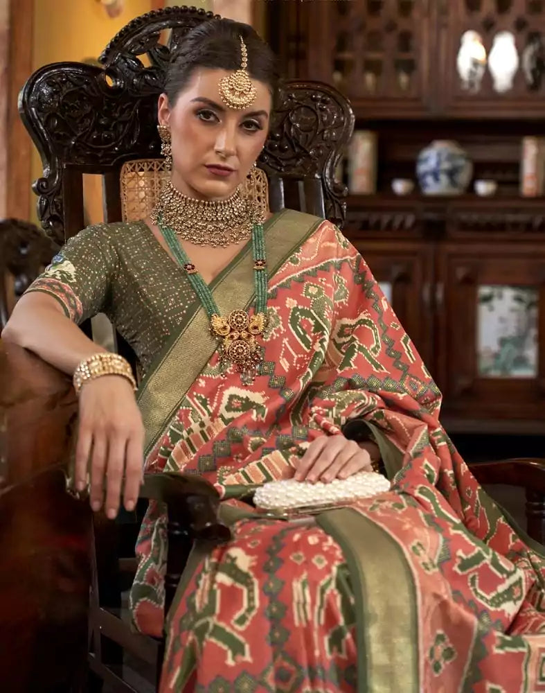 Image of Orange Ikat Print Patola Fancy Saree