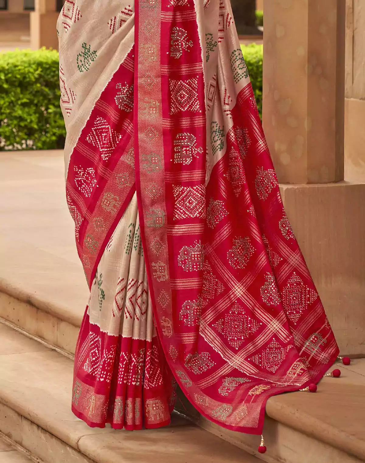 Image of Cream Coloured Patola Silk Mirror work Saree