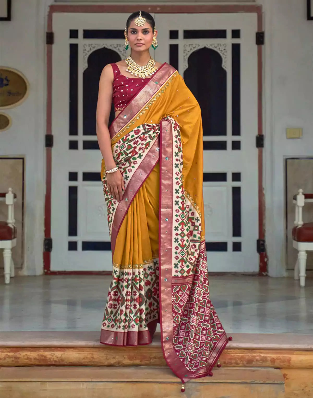 Image of Mustard and Maroon Mirror work Patola Silk Saree