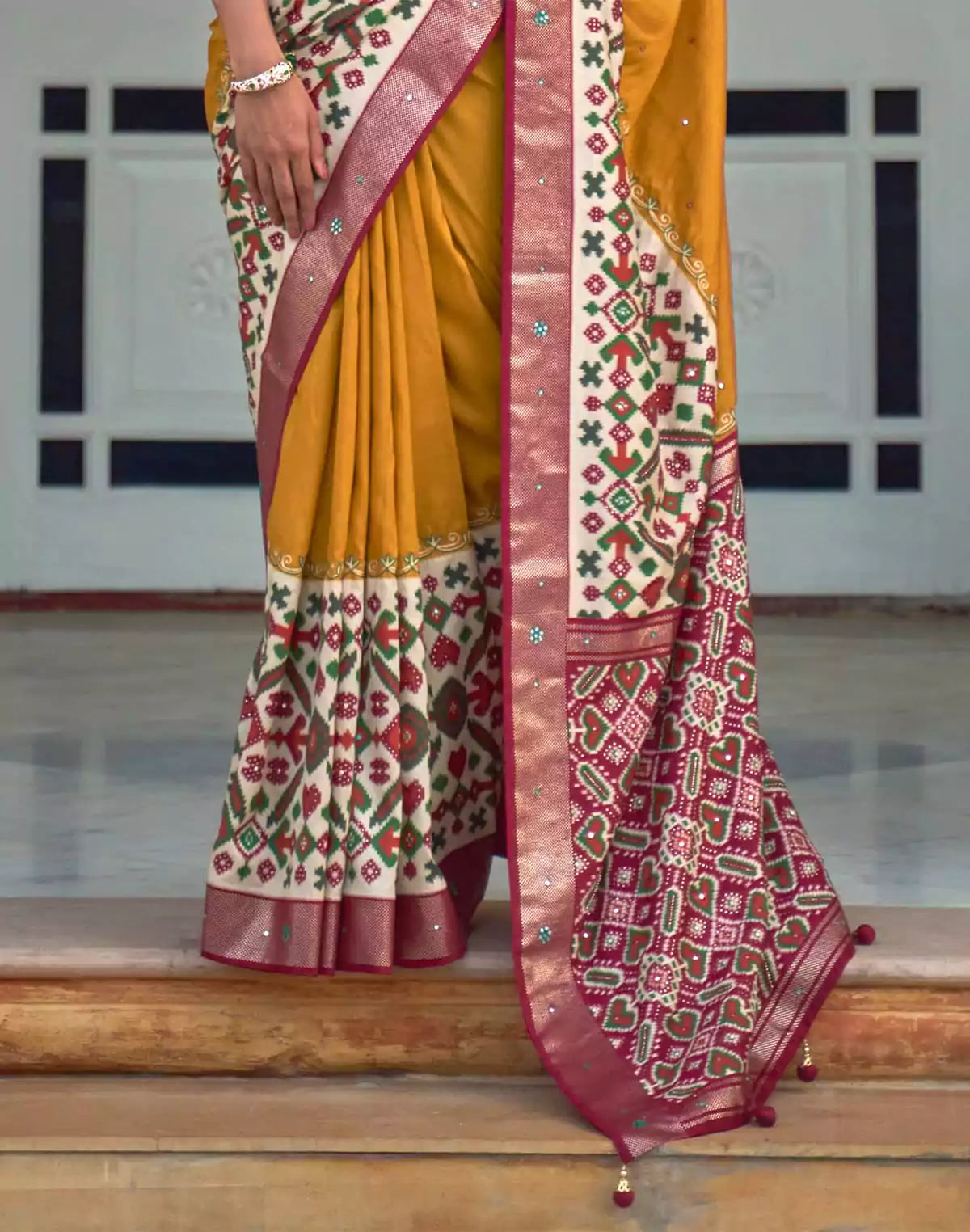 Image of Mustard and Maroon Mirror work Patola Silk Saree