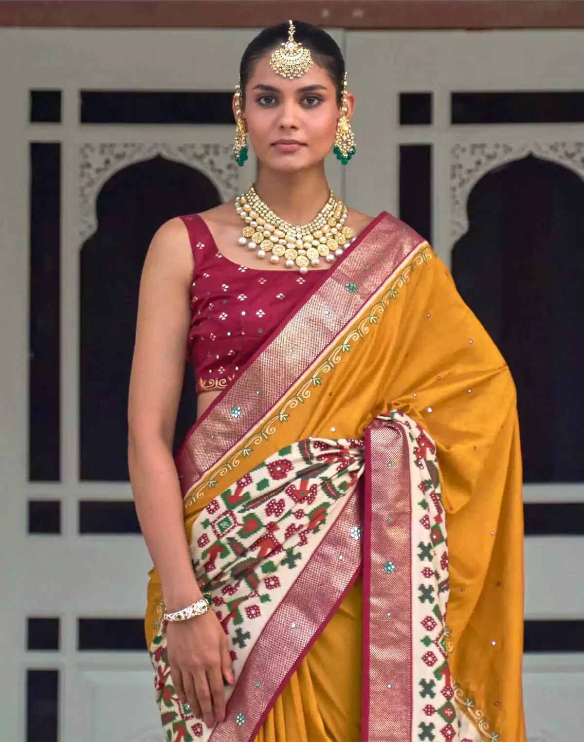 Image of Mustard and Maroon Mirror work Patola Silk Saree