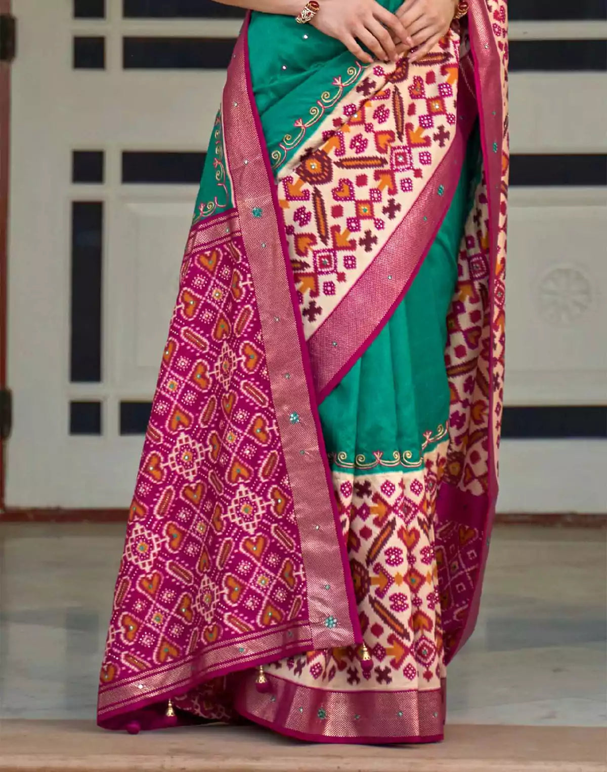 Image of Sea Green Patola Silk Mirror work Saree