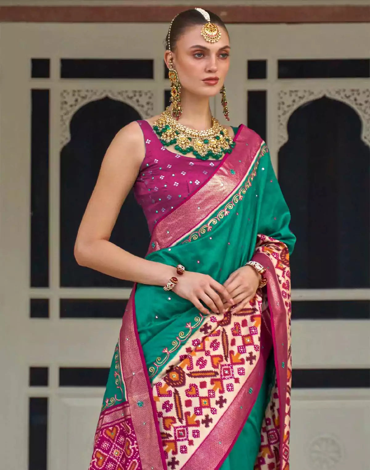 Image of Sea Green Patola Silk Mirror work Saree
