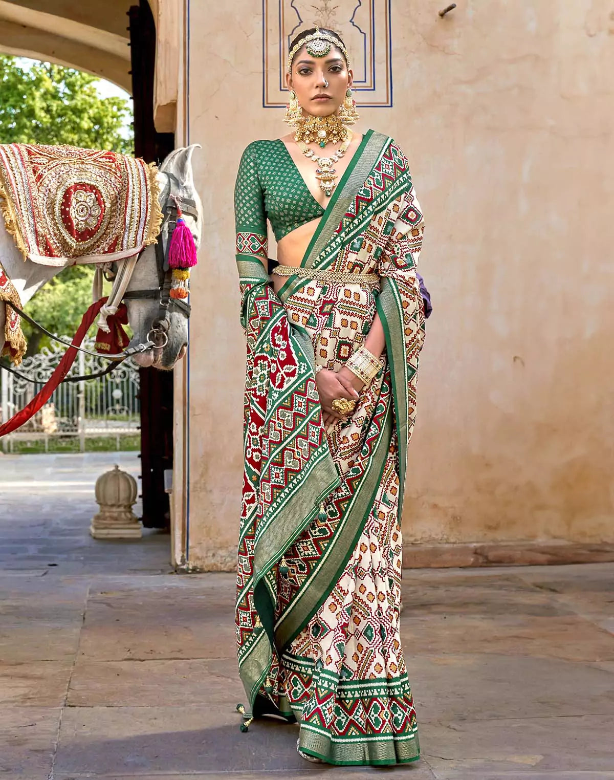 Image of Green Ikat Patola Silk Saree with Unstitched Blouse