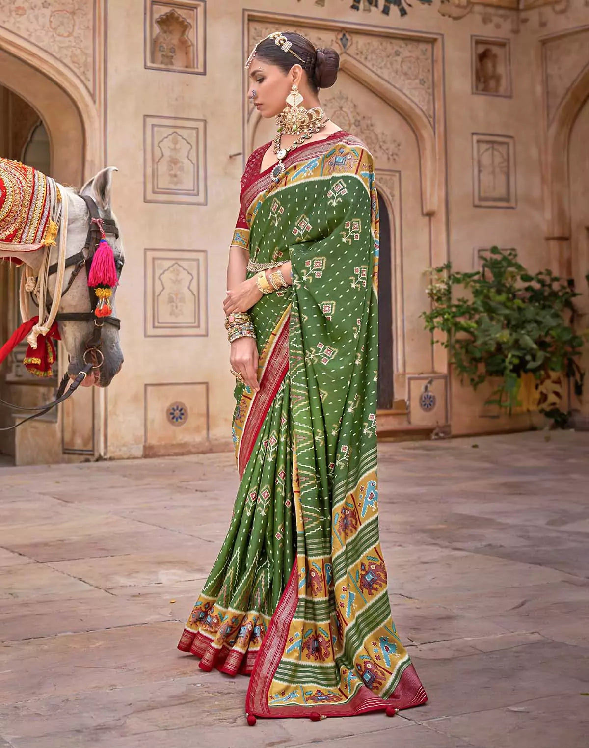 Image of Dark Green smooth fabric Patola Saree