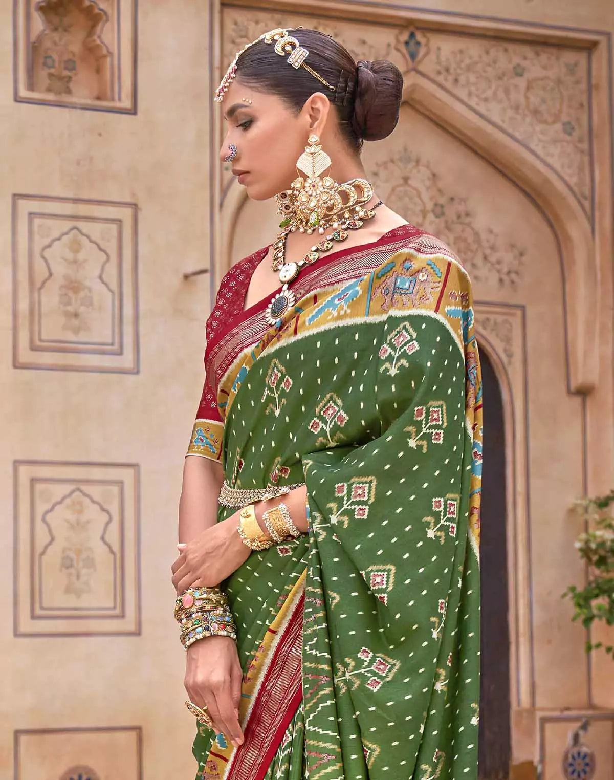 Image of Dark Green smooth fabric Patola Saree