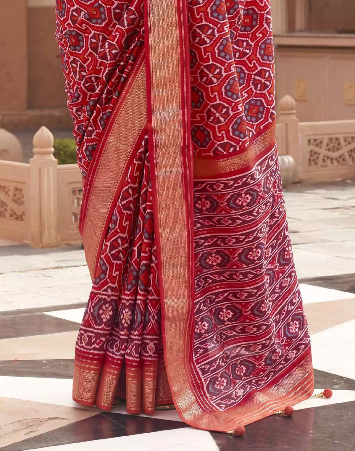 Image of Red Ikat Print Patola Saree with Contrast Zari Border