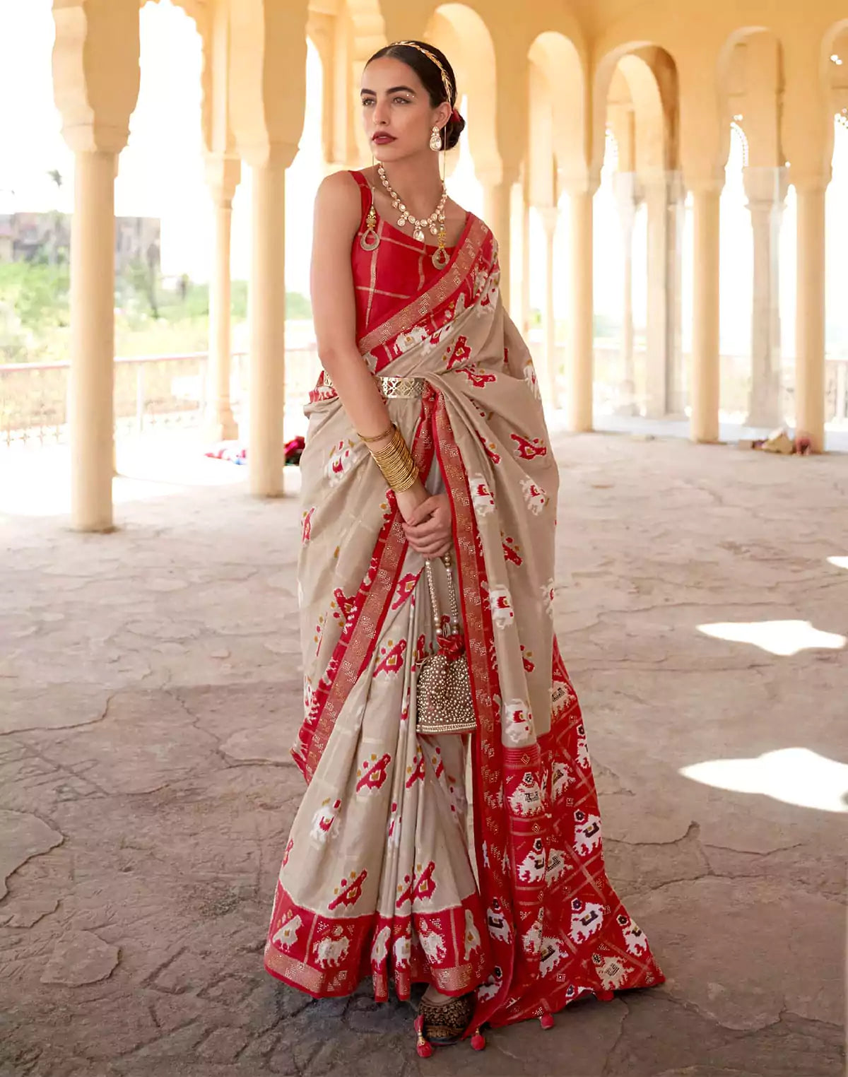 Image of Elegant Beige Woven Design Patola Saree