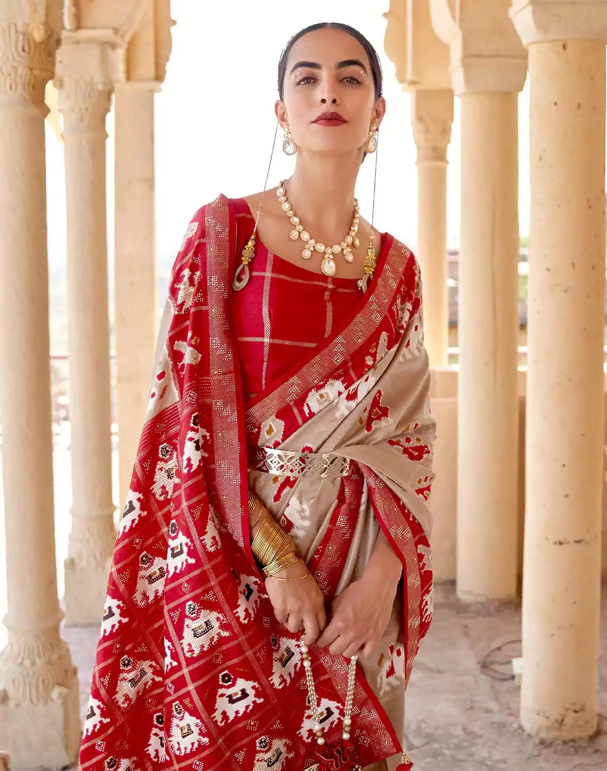 Image of Elegant Beige Woven Design Patola Saree