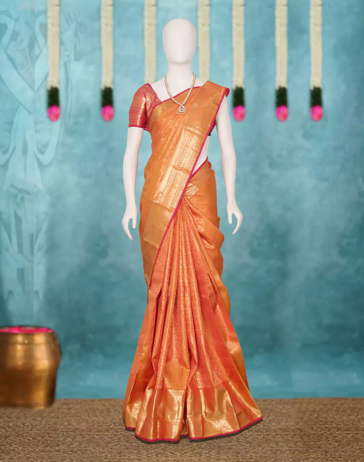 Orange Floral Golden Zari Kanchi Pattu Saree with Skut Border