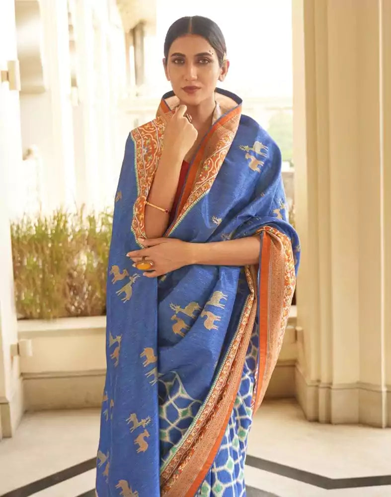 Image of Blue Ikat Print Dola Silk Fabric Saree
