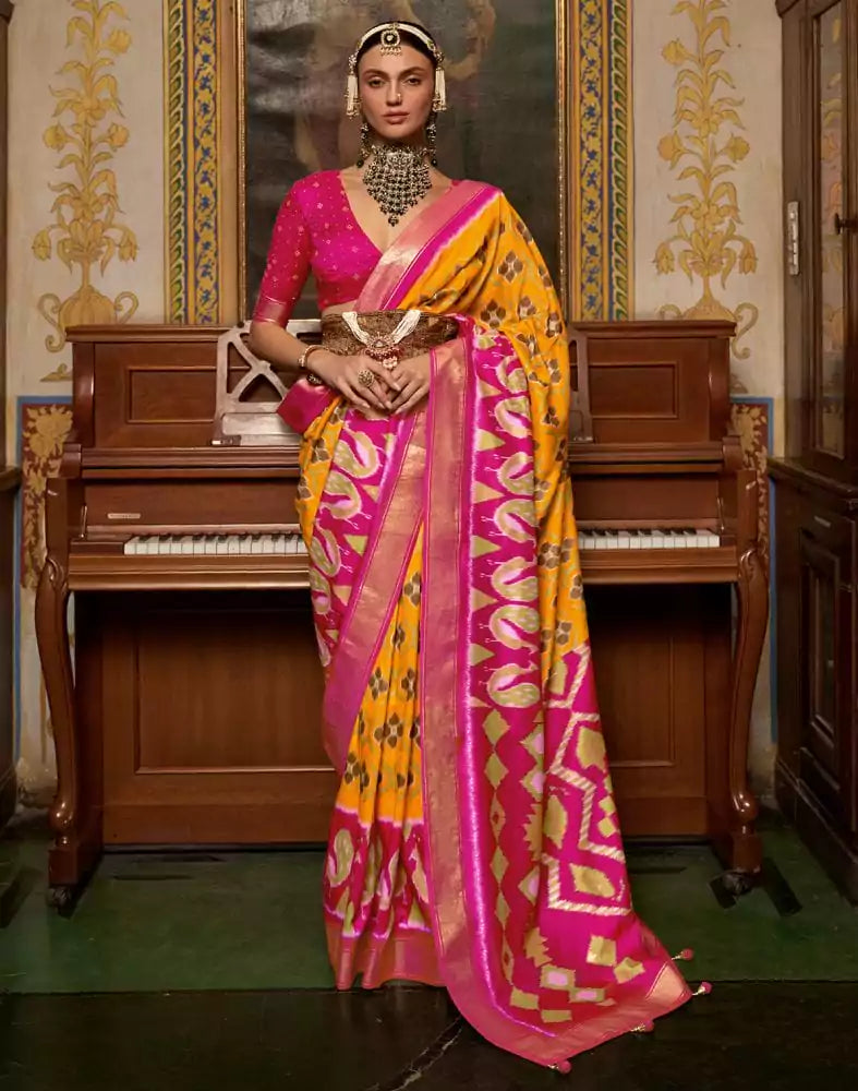 Image of Mustard and Pink Ikat Print Dola Silk Saree