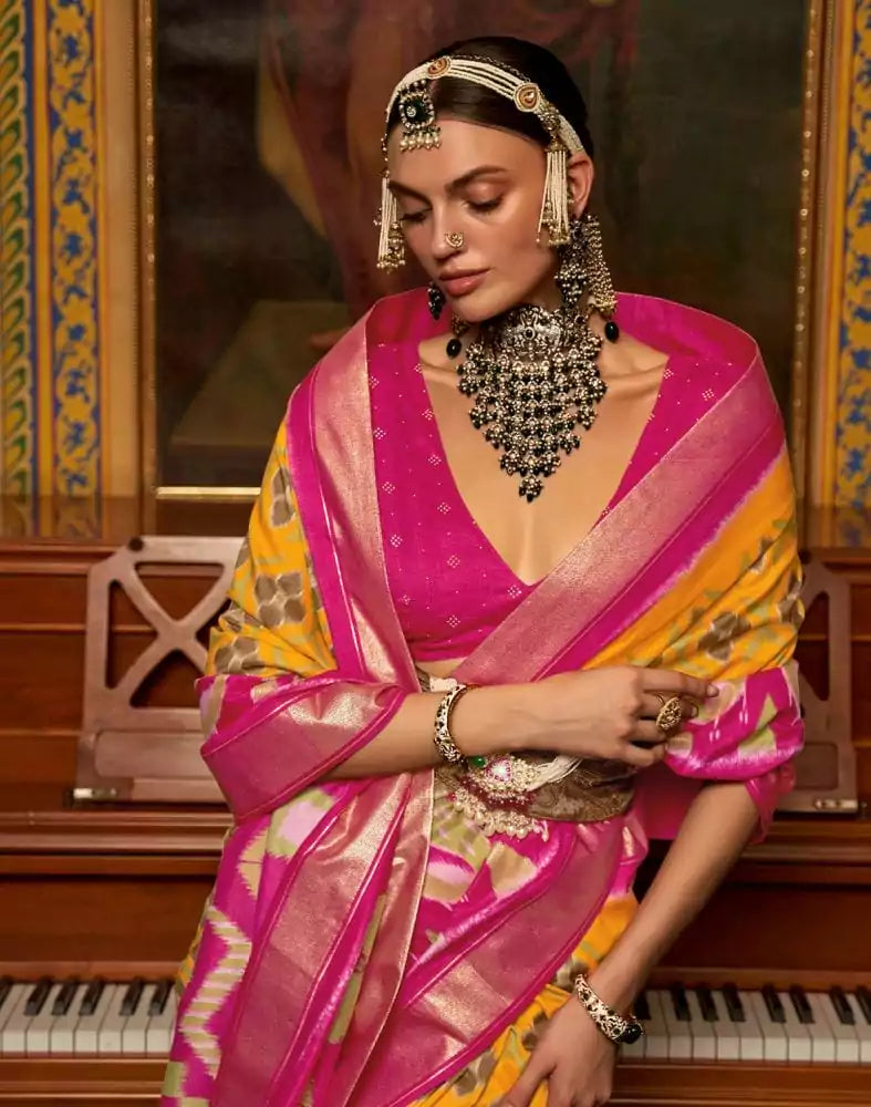 Image of Mustard and Pink Ikat Print Dola Silk Saree