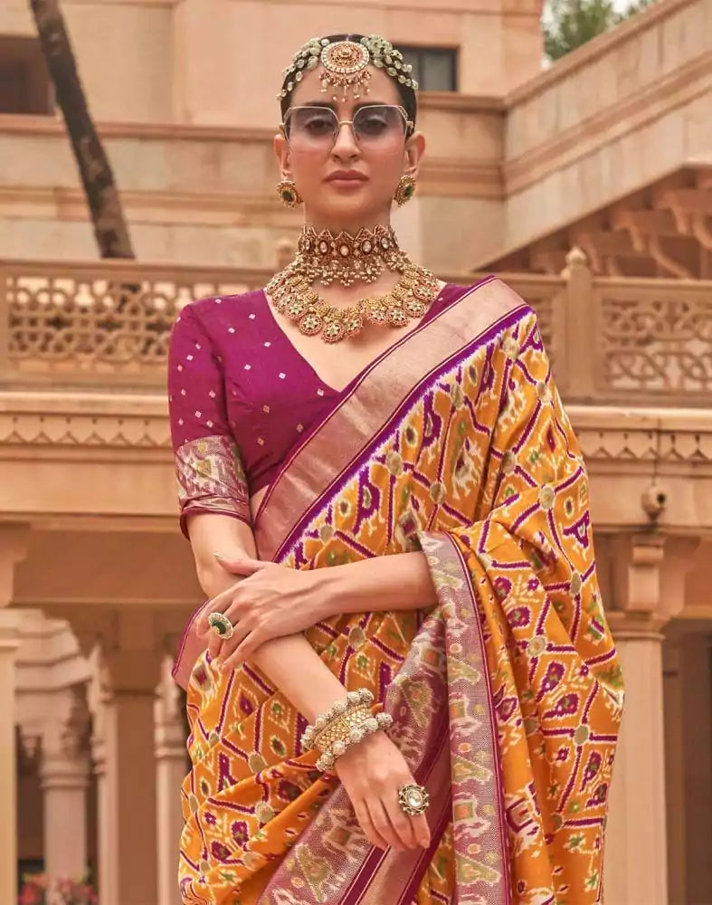 Image of Mustard and Pink Ikat Print Patola Silk Saree