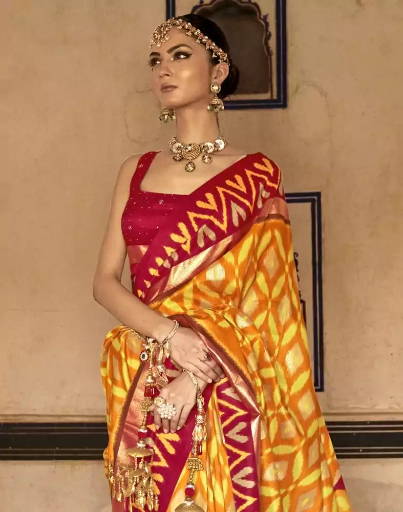 Image of Mustard and Red Ikat Print Soft Dola Silk Saree