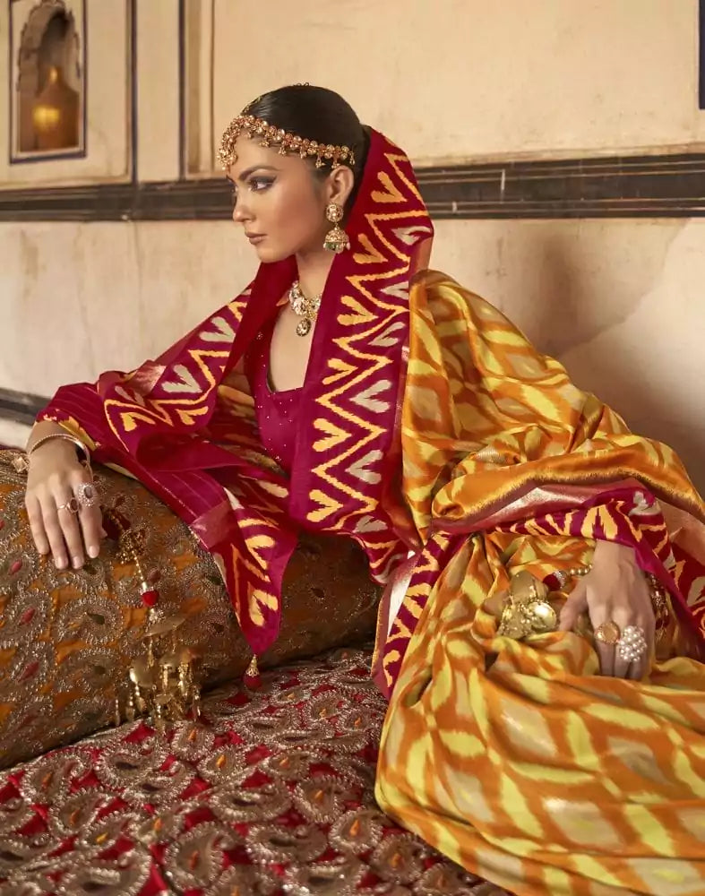 Image of Mustard and Red Ikat Print Soft Dola Silk Saree