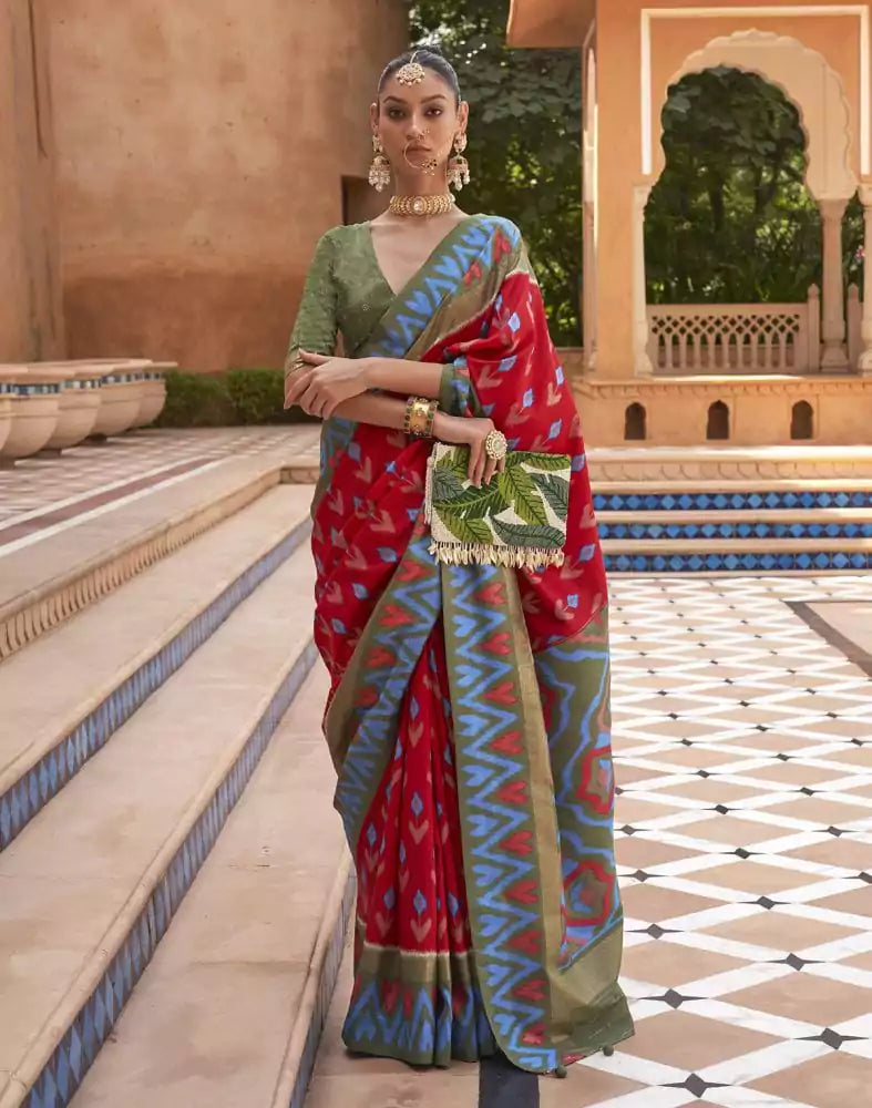 Image of Red and Green Ikat Print Dola Silk Saree