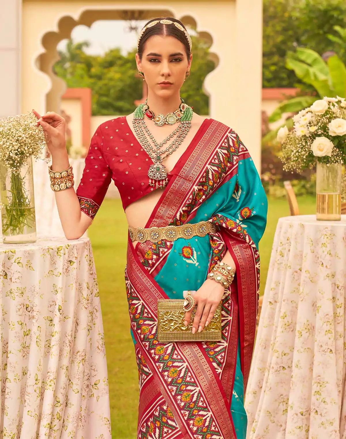 Image of Dazzling Teal Blue Patola Print Trendy Saree